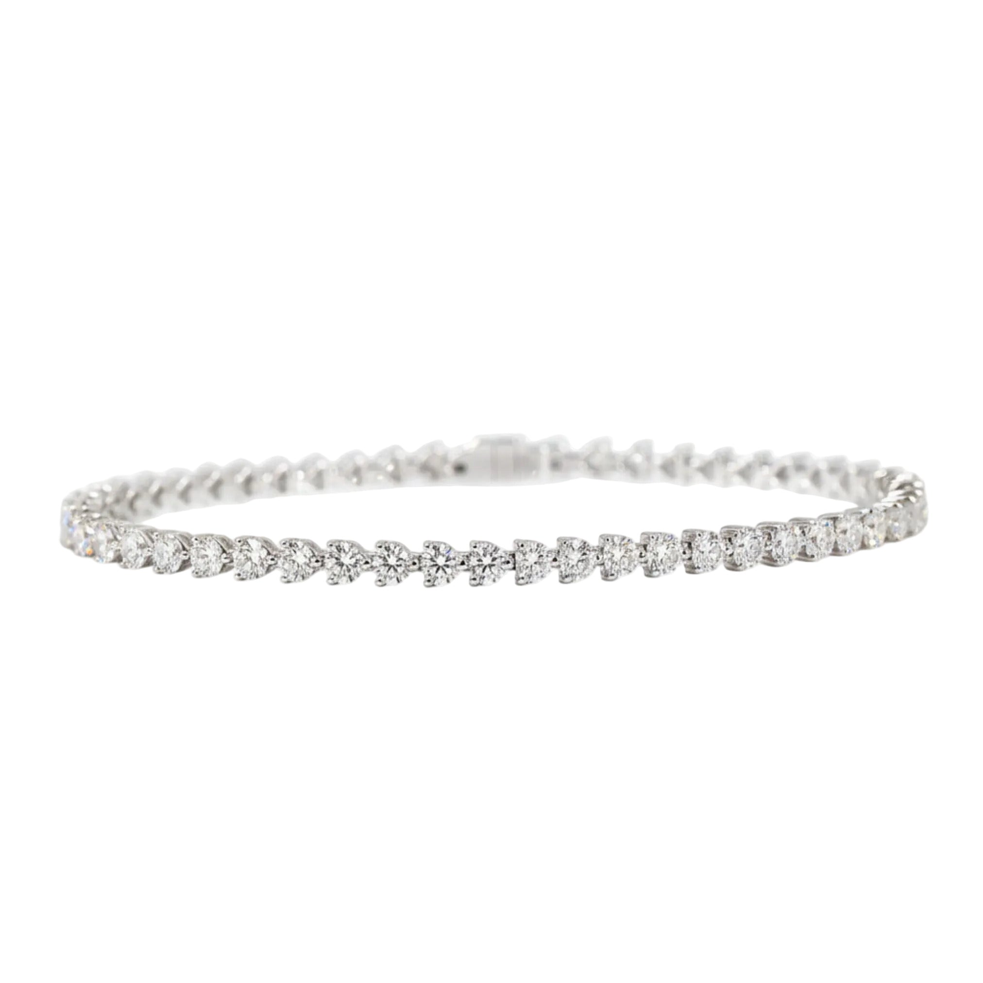 line heart shape tennis bracelet with clear stones on a white gold