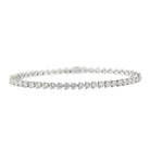line heart shape tennis bracelet with clear stones on a white gold