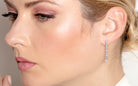 model wearing drop diamond earring