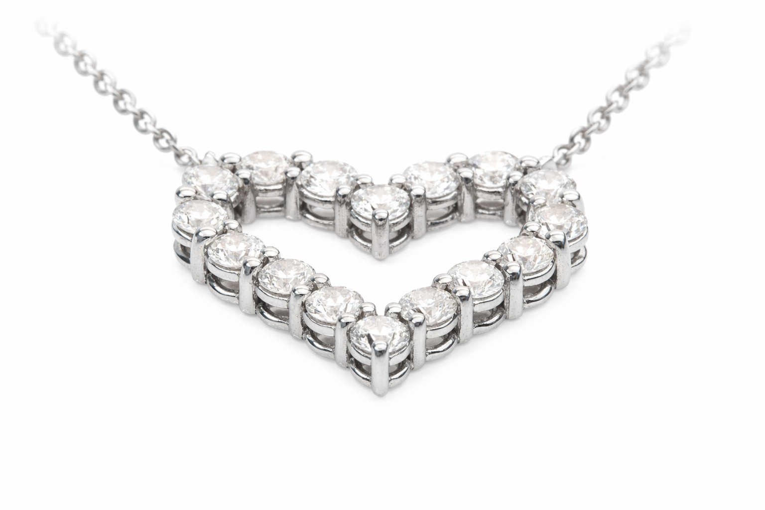 Diamond necklace with a heart-shaped design on a white background
