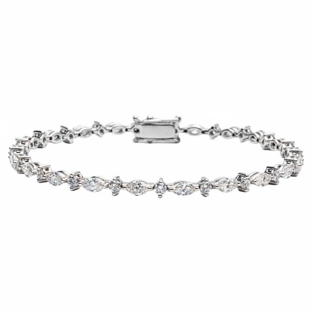 A tennis bracelet featuring marquise and round diamond shapes, set in a white gold band,