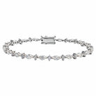 A tennis bracelet featuring marquise and round diamond shapes, set in a white gold band,